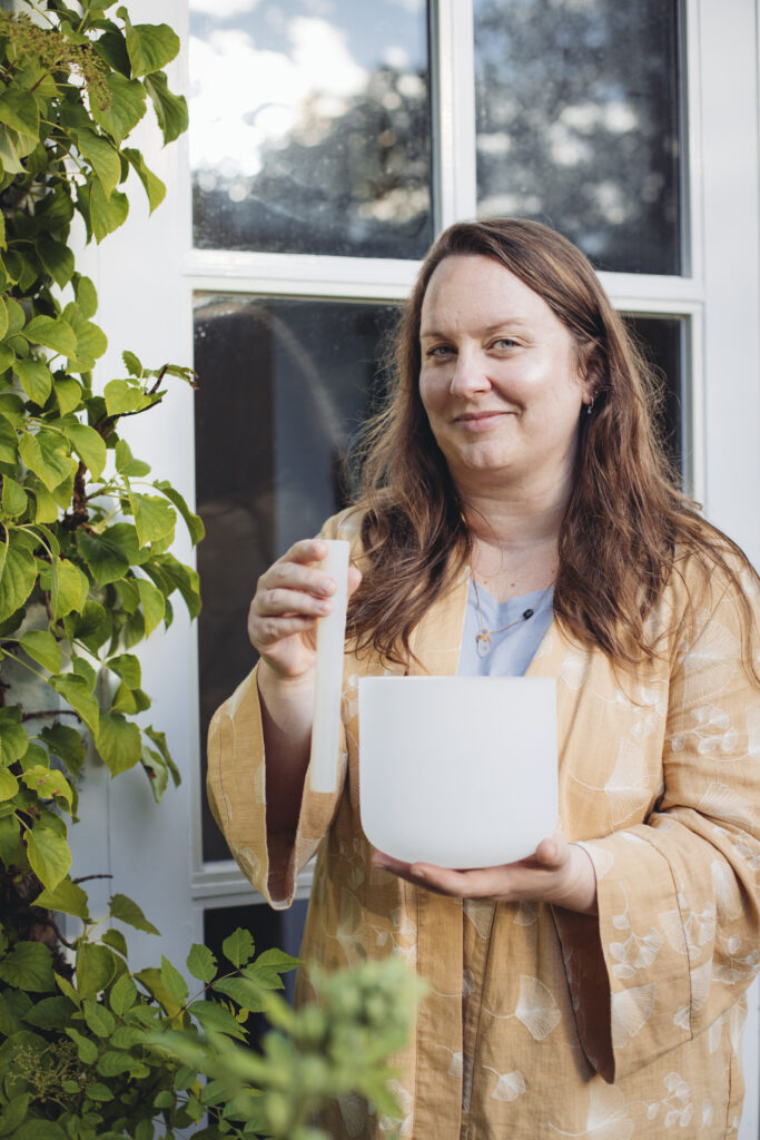 Agata holding a crystal bowl at Woman's retreat in Zeeland